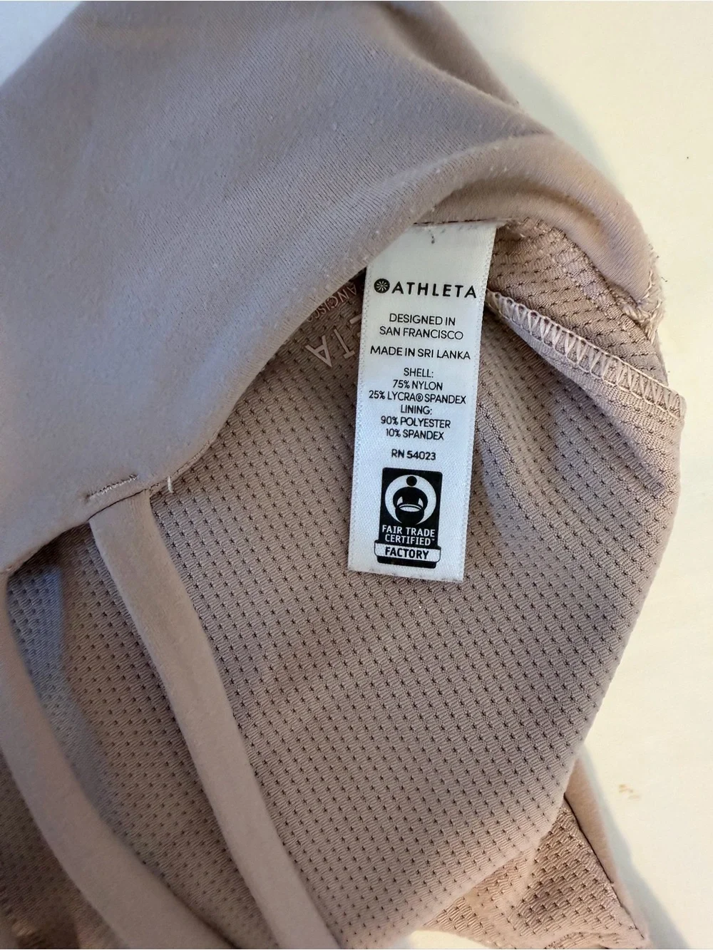 Athleta women’s strappy padded light purple mauve sports bra